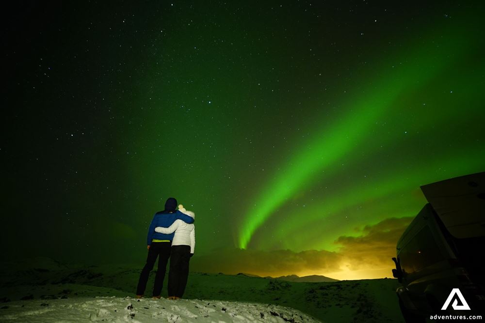 Couple Enjoying Aurora Borealis