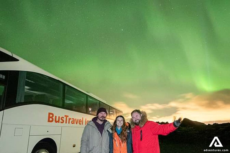 Group Enjoying Aurora Tour in Iceland