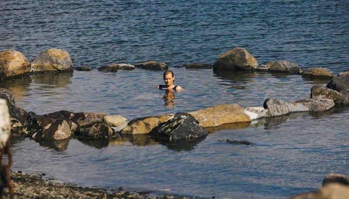 Woman in Icelandic Hot Springs by Ocean