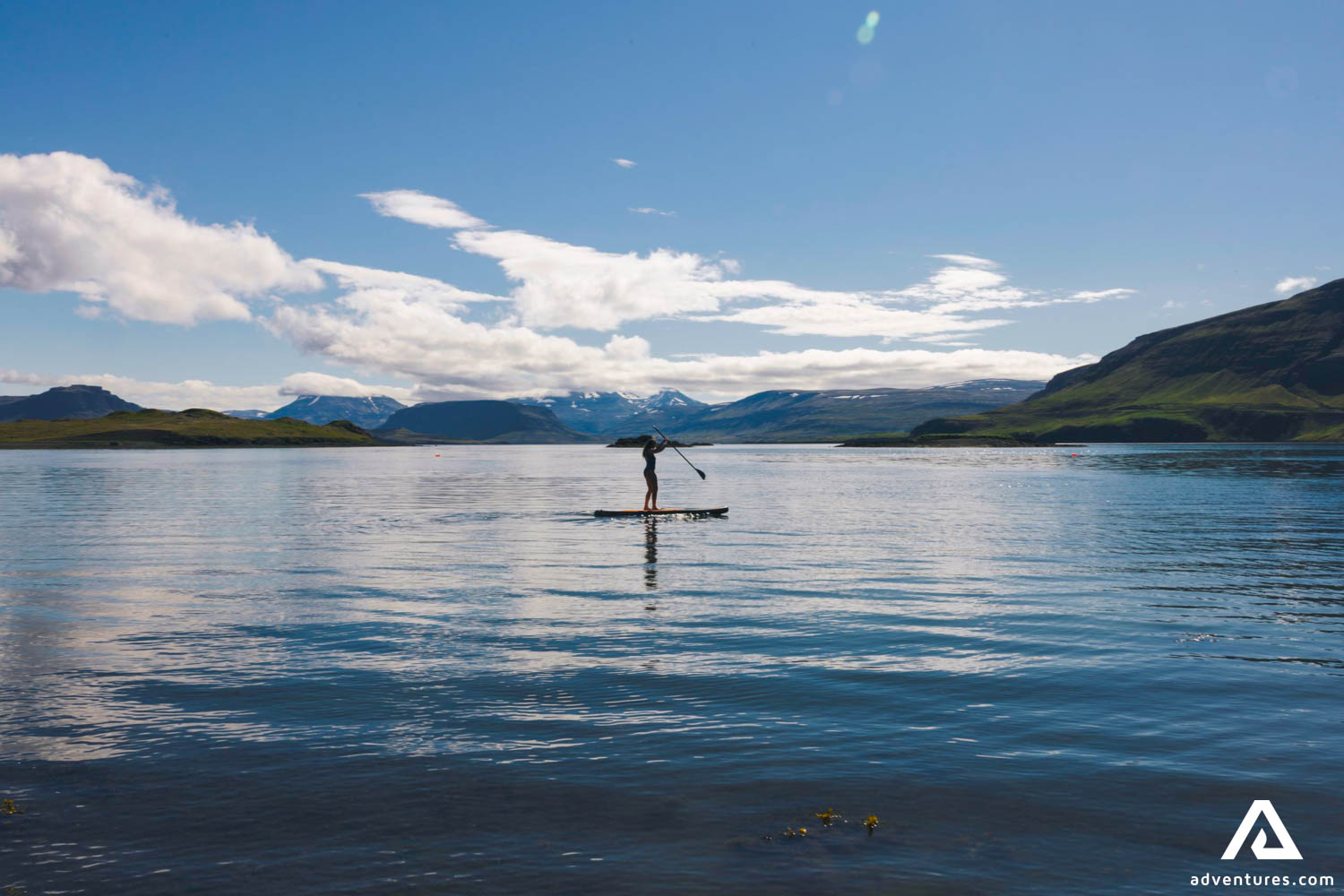 Woman Paddle Boarding in Ocean