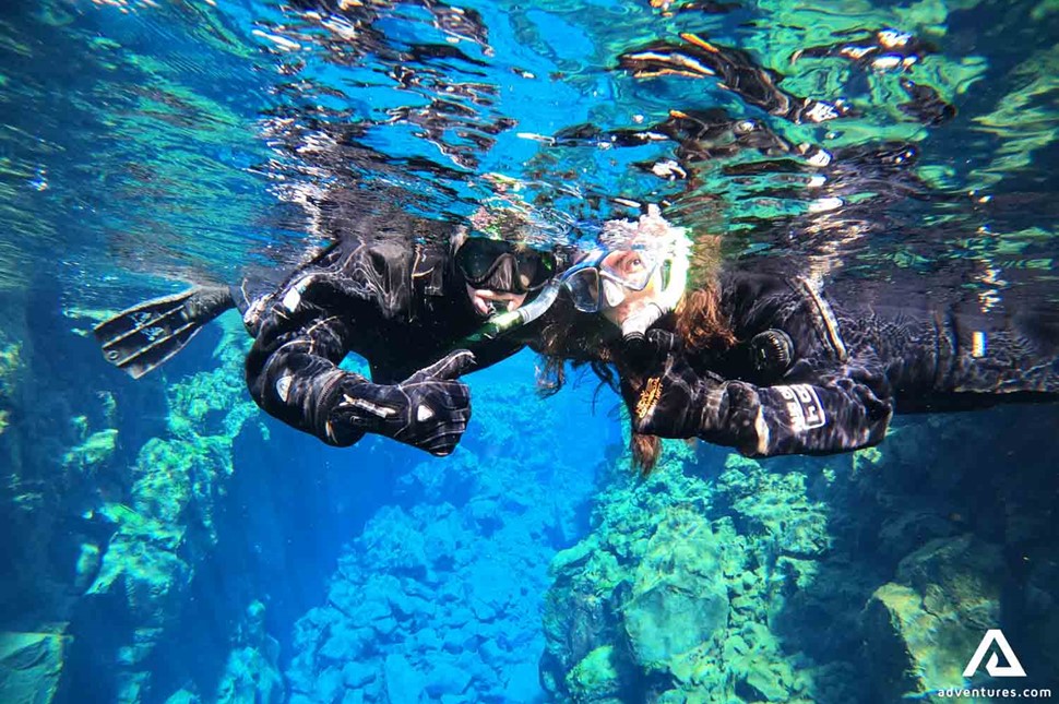 Happy Couple Snorkeling in Silfra Fissure