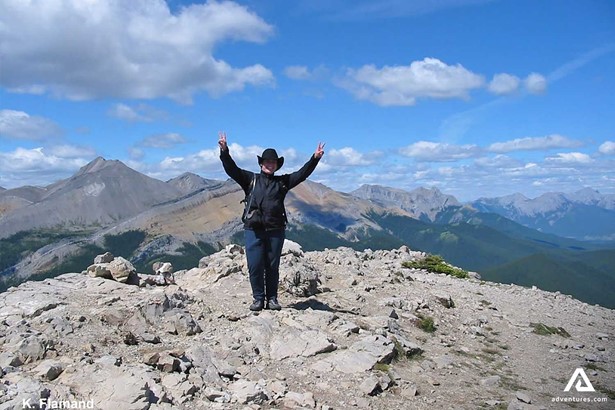 Woman Climbed on a Rocky Mountain
