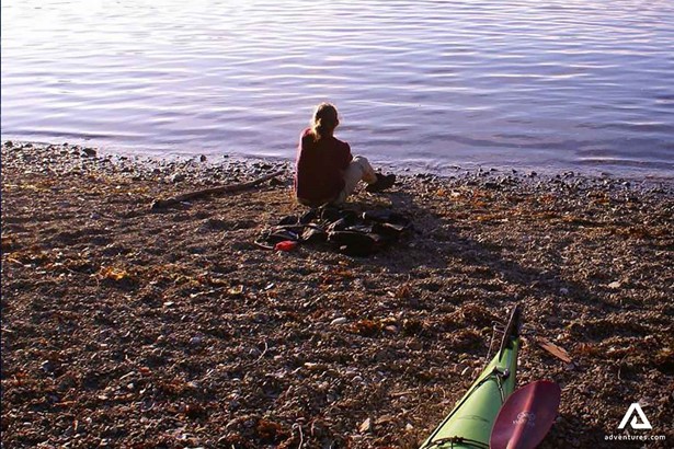 Woman Sitting by Seashore in Vancouver Island