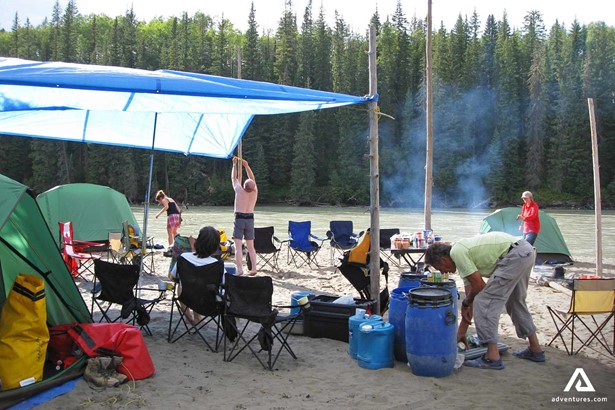 People Camping by Athabasca River in Canada