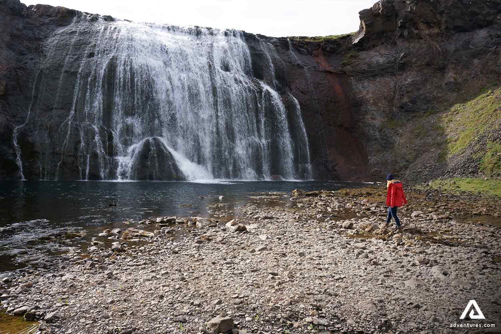 Woman Walking by Thorufoss Waterfall