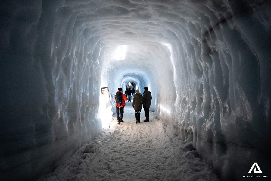 People Exploring Ice Tunnel
