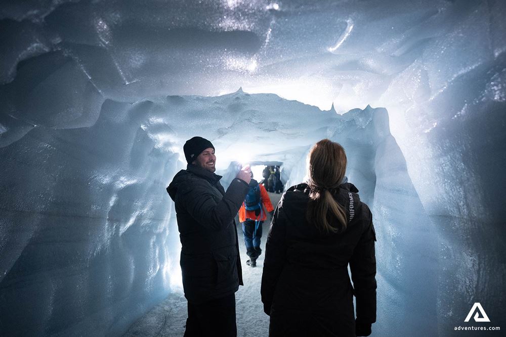 Couple Taking Photos in Ice Cave