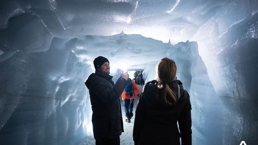 Couple Taking Photos in Ice Cave