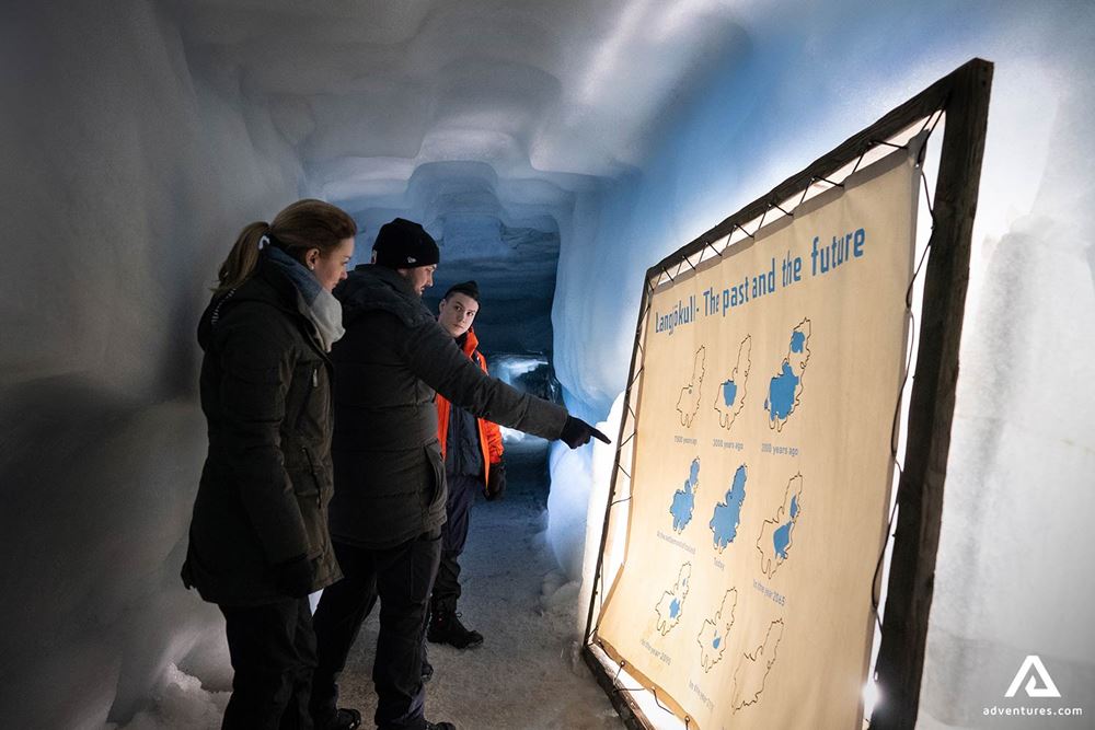 People Looking to Map in Ice Cave