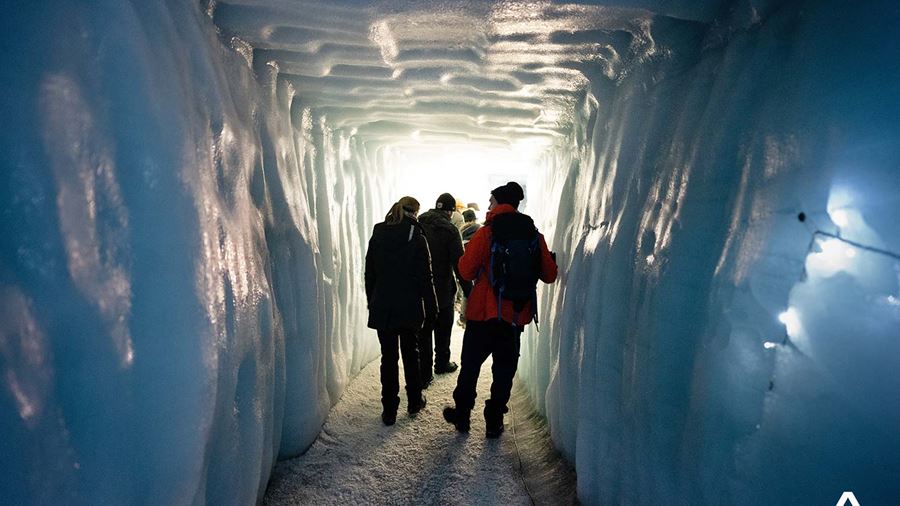 Tourists Walks in Ice Tunnel