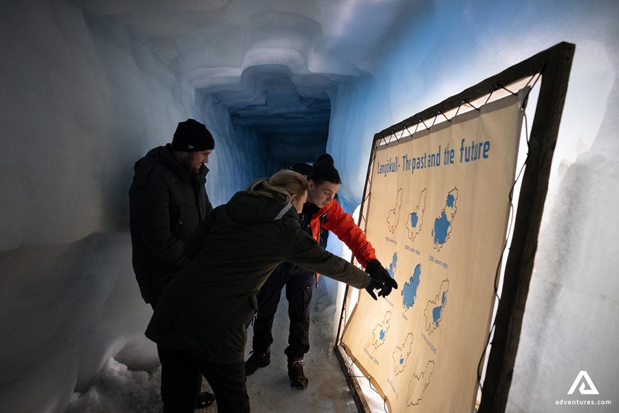 Tourists Looking at Map in Ice Cave