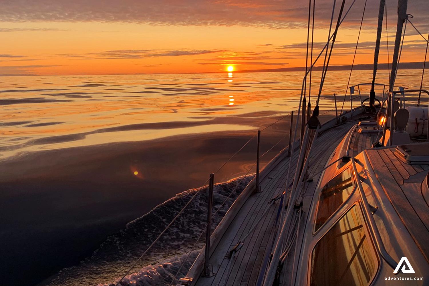 Yacht Swimming in Sea During Sunset