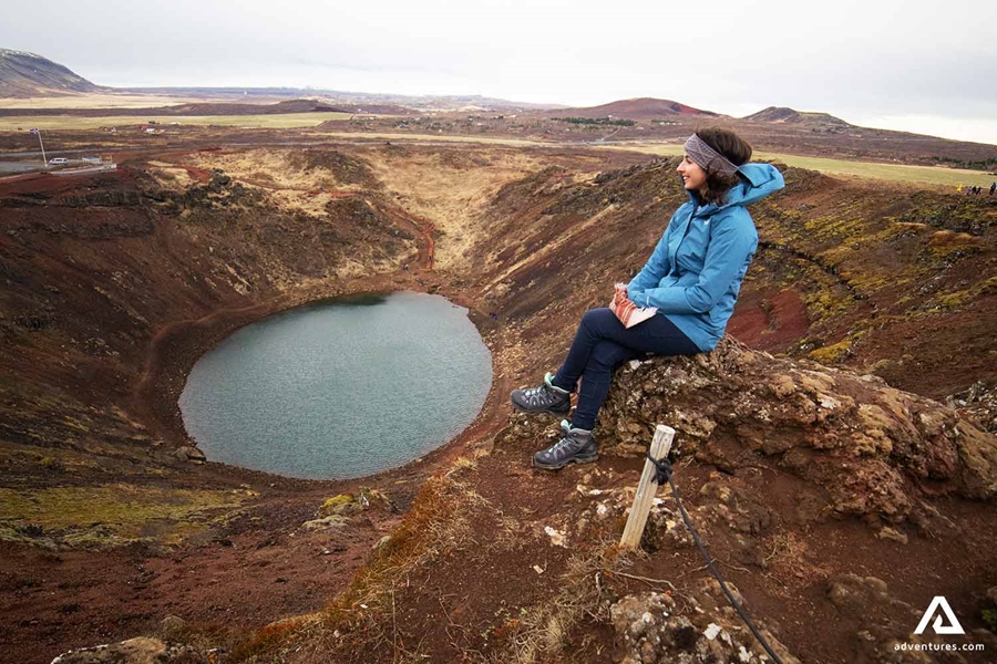Woman Sitting near Crater