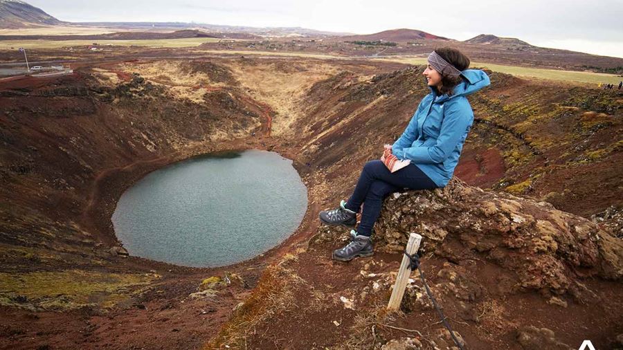 Woman Sitting near Crater