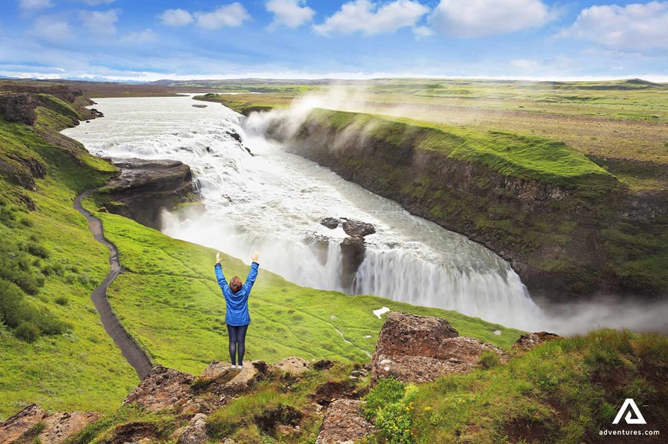 Happy Woman at Gullfoss Waterfall in Iceland