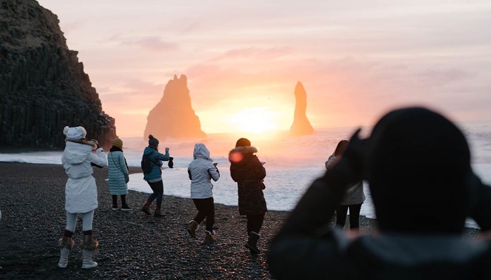 People Taking Pictures of Reynisfjara Beach at Sunset