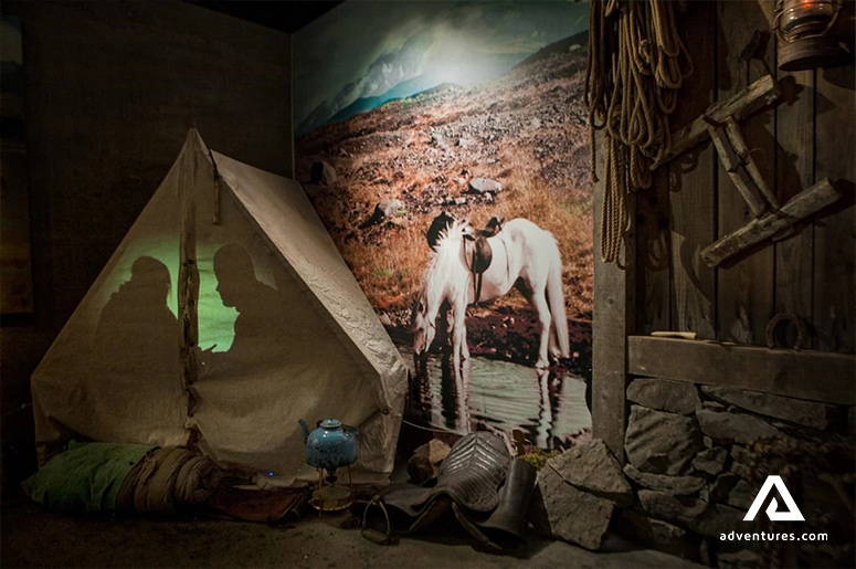 Historic camping site props in wilderness center history exhibition.