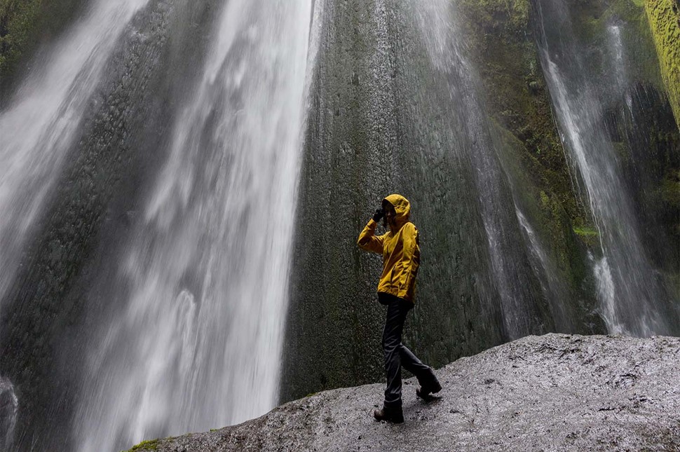 Famous Iceland Waterfall Godafoss with Woman Standing Observing Nature