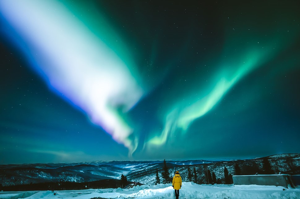 Woman and Colorful Northern Lights in Iceland