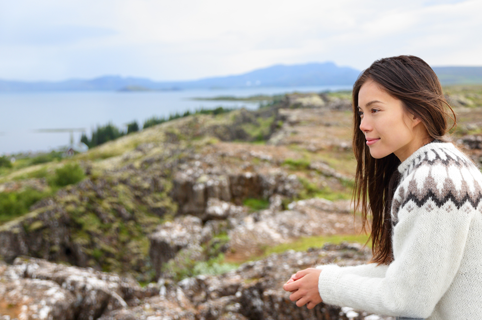 A woman in an Icelandic sweater at Þingvellir, the site of the ancient Aþingi