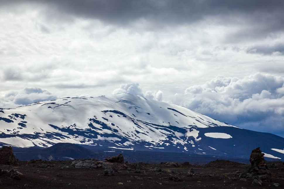 Hekla volcano in Iceland topped with snow against a cloudy sky