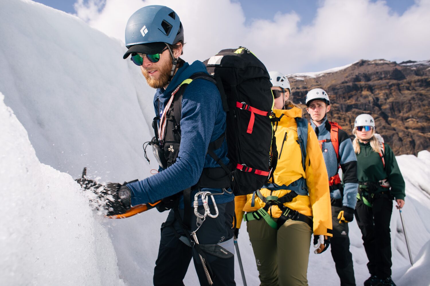 Group of people hiking on glacier