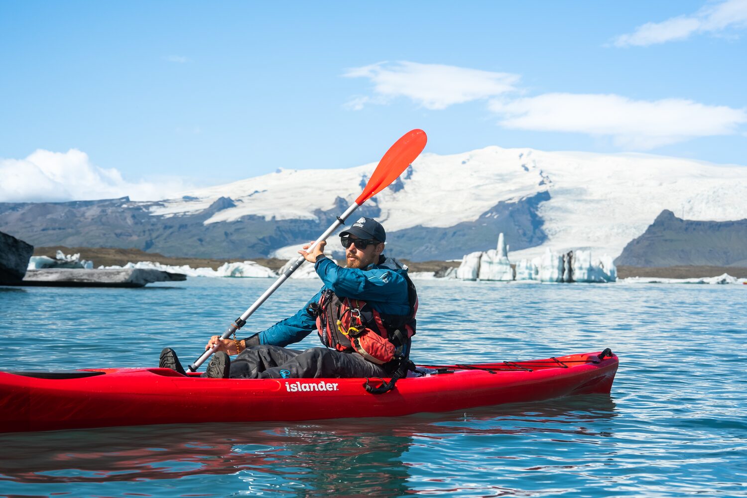Man kayaking in glacier lagoon