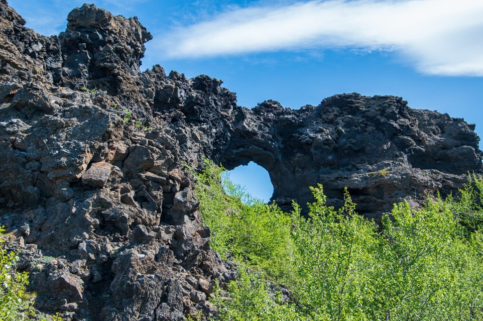 Summertime greenery on the backdrop of lava arch