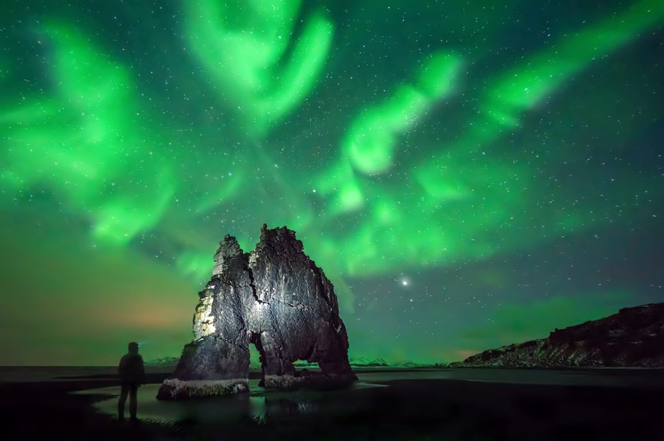 Hvitserkur on aurora borealis background