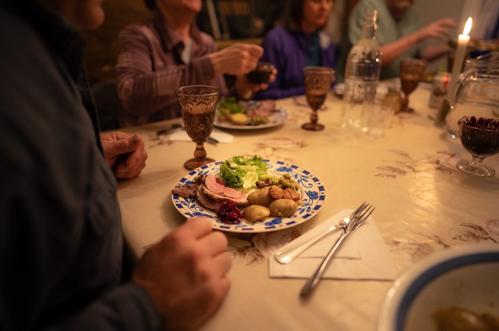 People having dinner in Icelandic guesthouse