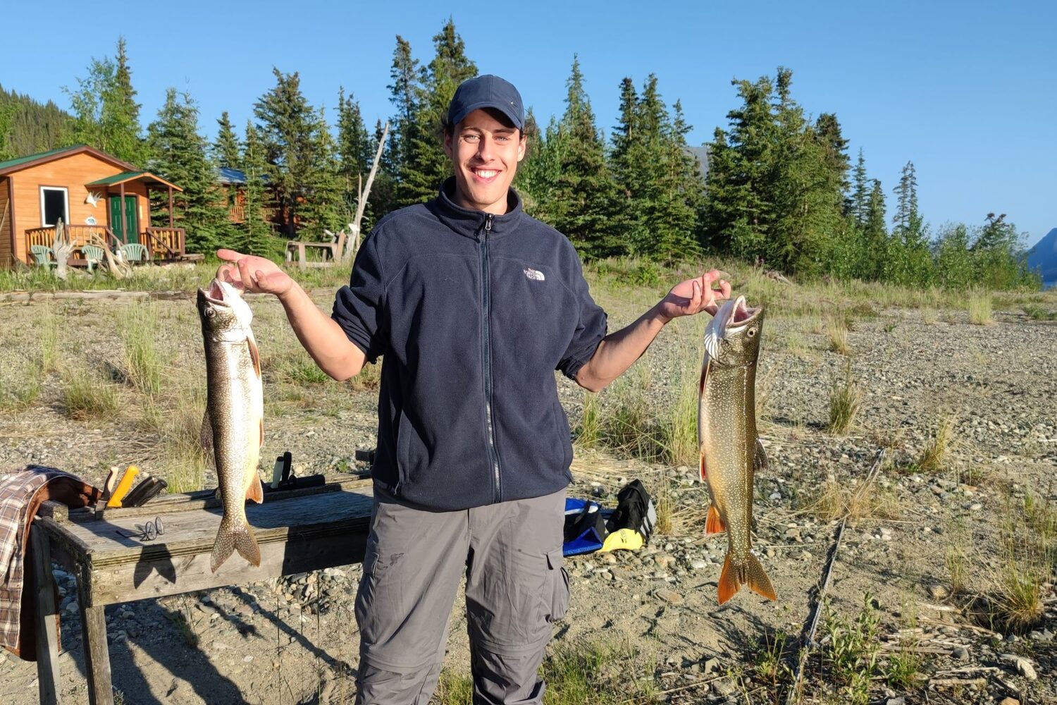 Man holds two fishes