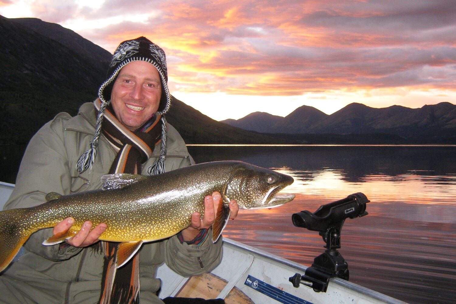 Man caught fish at sunset