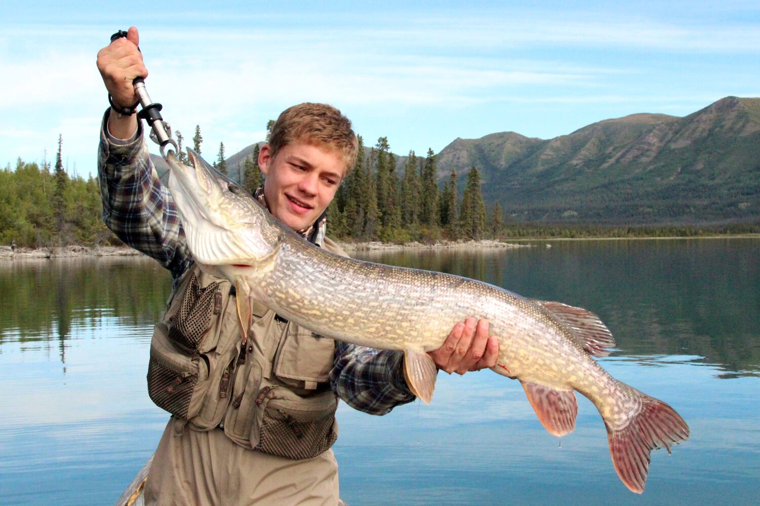 Man showing caught fish