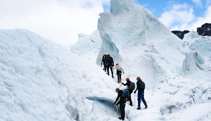 Tour group climbing on glacier in Iceland