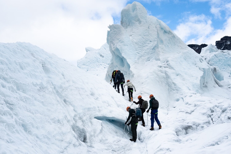 Tour group climbing on glacier in Iceland