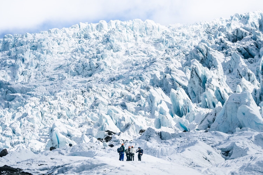 Group by huge glacier in Iceland