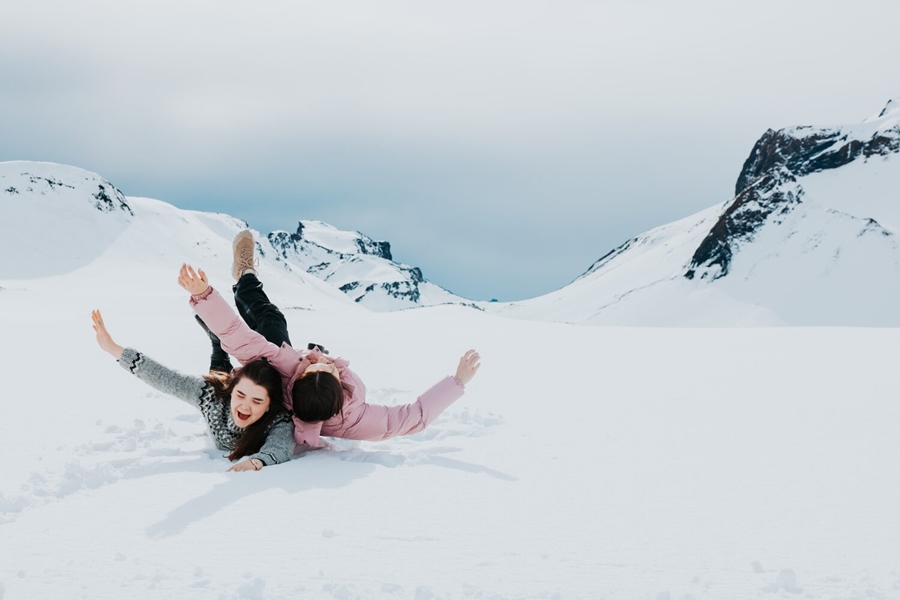 Women playing on the snow in Iceland