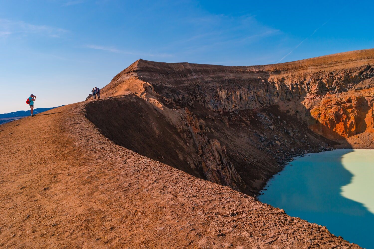 Icelandic landscape colourful colvanic caldera Askja Viti Craterlake with red, and turqoise soil and hiking trail, Iceland