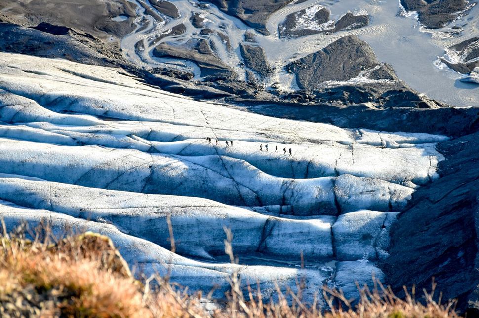 Aerial view of Sólheimajökull Glacier Hike Aerial view of Sólheimajökull Glacier Hikers walking across glacier