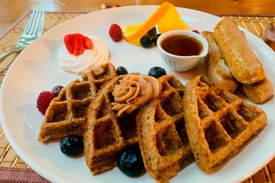 Breakfast waffles syrup and berries
