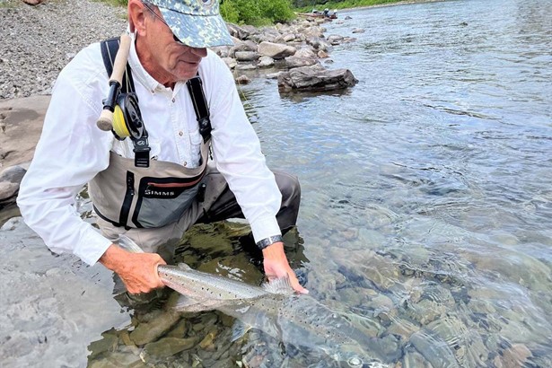 Man caught salmon in Canadian river