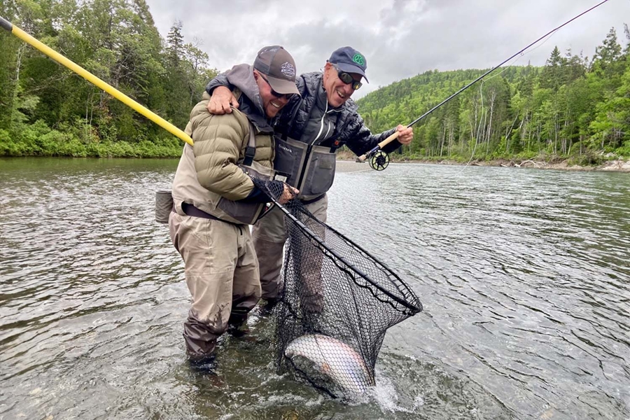 Two men caught salmon in river