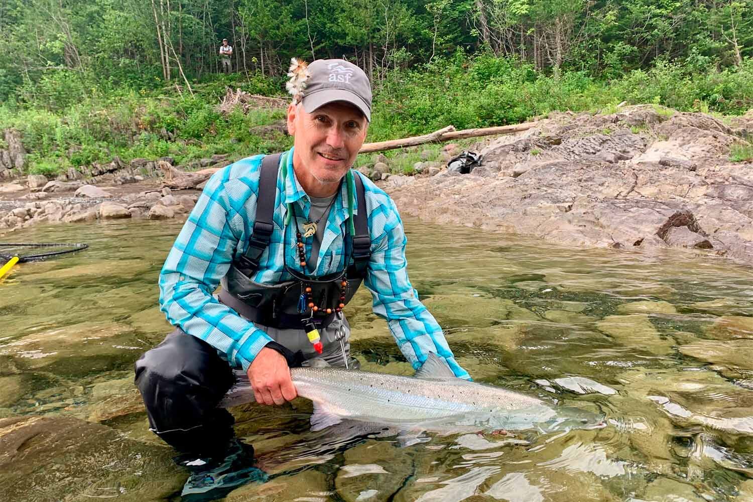 Fisherman caught fish in Cascapedia river