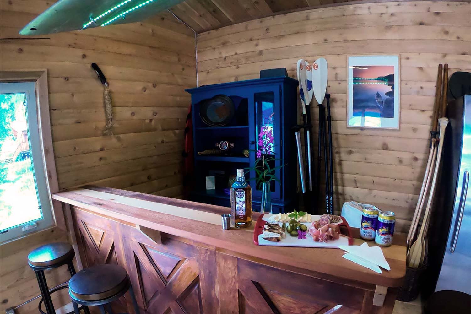 Bar with drinks and snacks in wooden lodge