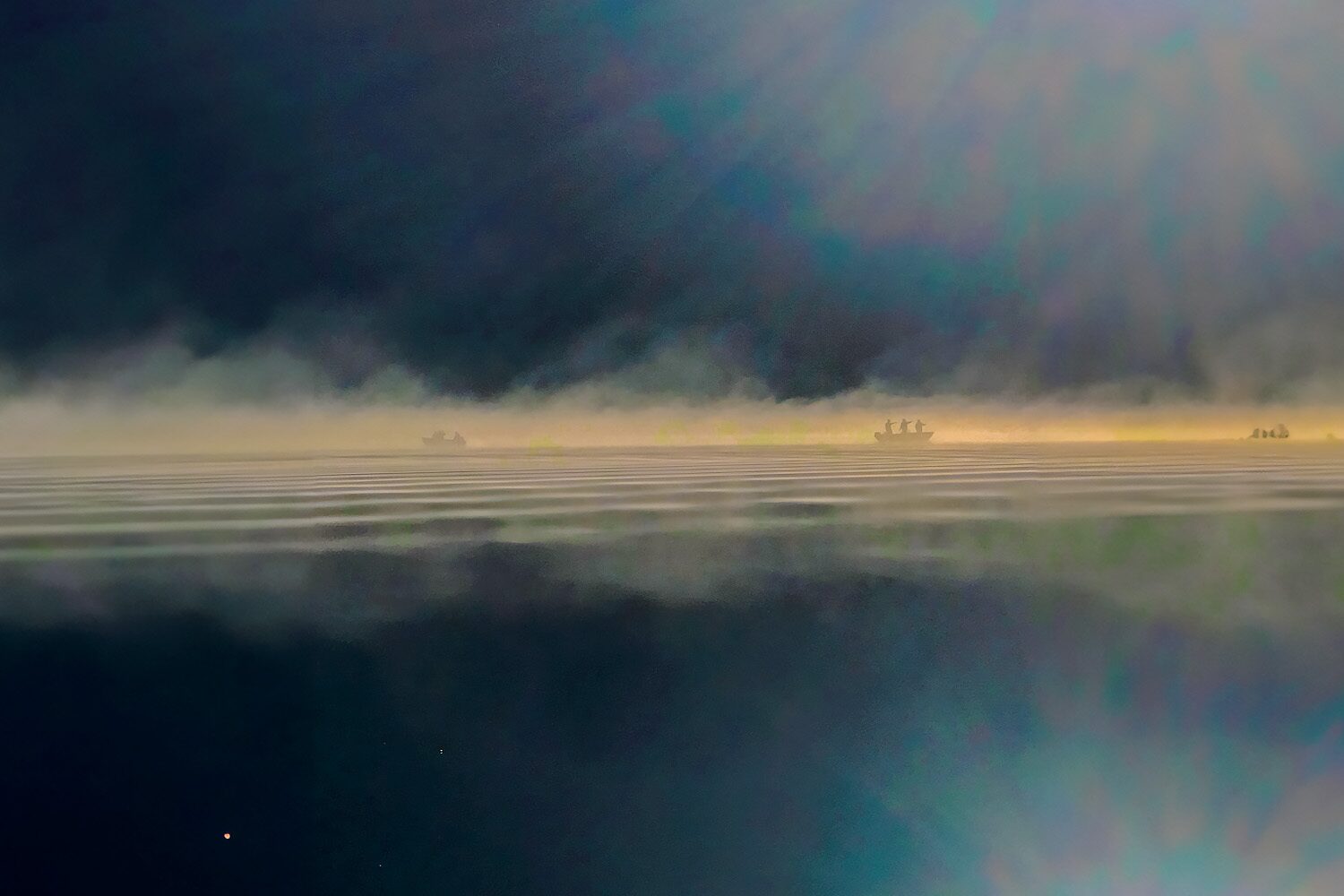 Boat fishing tour on lake during early morning