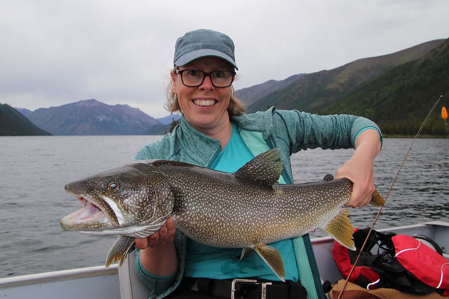 Happy woman holding salmon