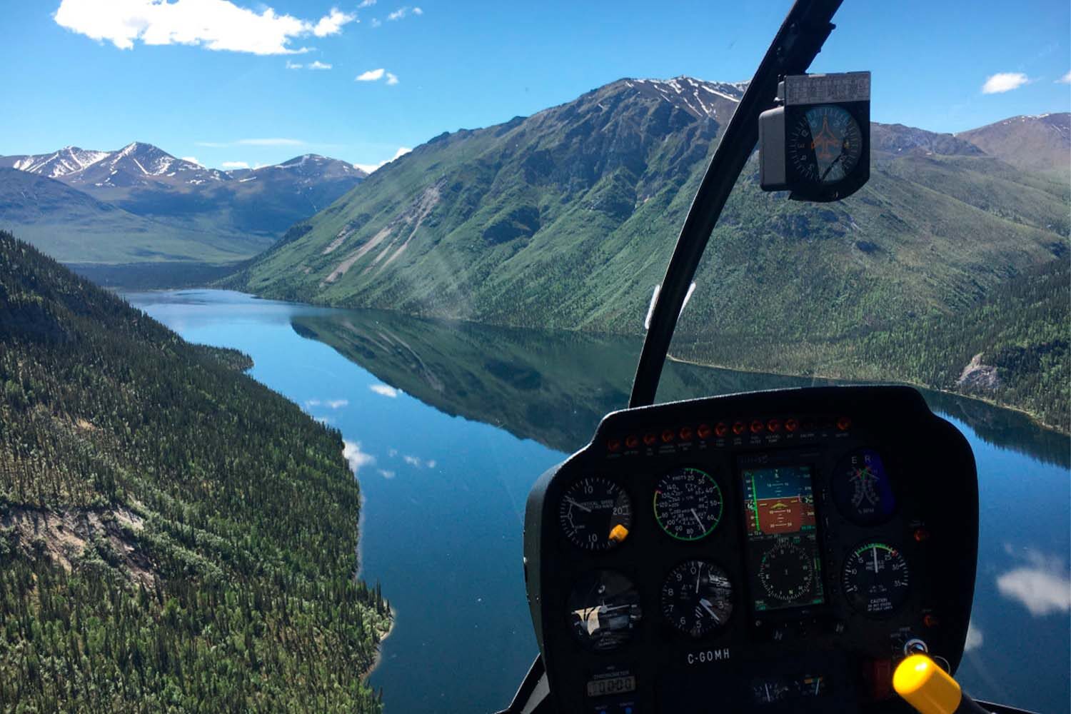 Lake and mountains view from helicopter in Yukon