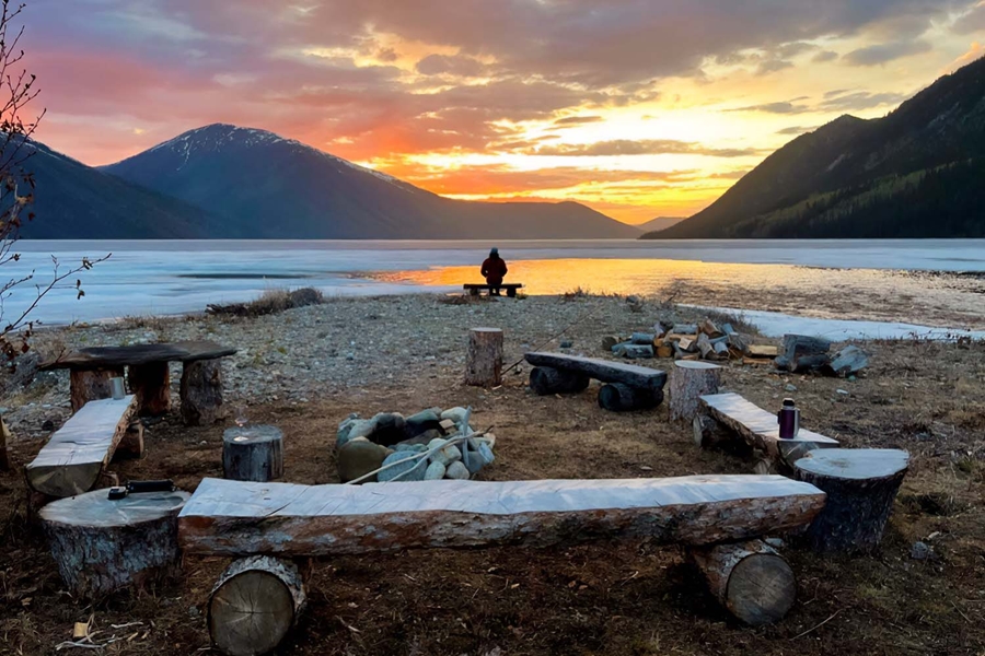 Fireplace by the lake during sunset in Yukon