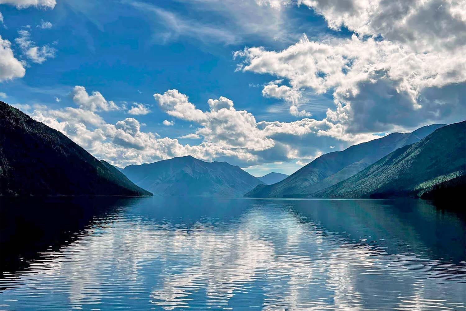 Tincup lake by mountains in Canada