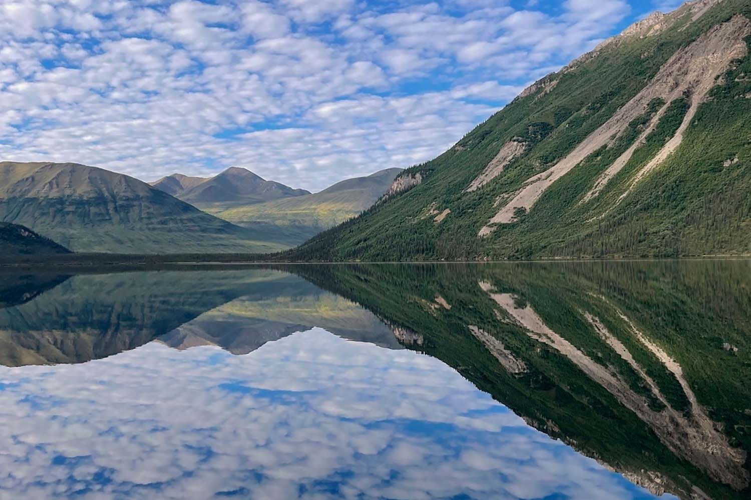 Tincup lake by the mountains during summer